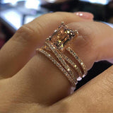 emerald cut morganite ring with double halo band