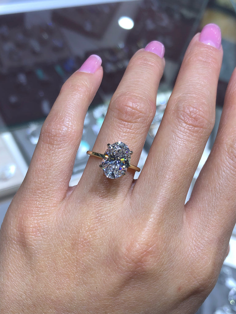 A stunning 3ct solitaire, oval-shaped lab-grown diamond engagement ring,  featuring a prominent, ethically sourced stone that radiates… | Instagram